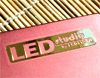 Наклейка LEDSTUDIO (золотистая) тип - 2 (8x58мм, прямоугольная)